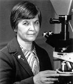 Stephanie Kwolek at a polarizing microscope. Gift of Stephanie Kwolek. Courtesy DuPont.